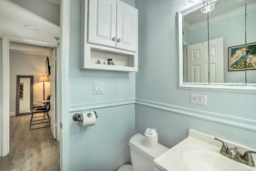 a bathroom with a white sink and a mirror at Indian Rocks Beach Duplex, Close to Beaches! in Clearwater Beach