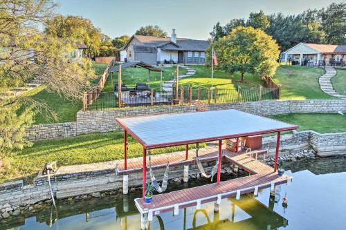 a table on a dock in a body of water at Granbury Home with Lake Granbury Access and Dock! in Granbury