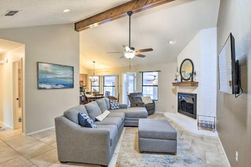 a living room with a couch and a fireplace at Granbury Home with Lake Granbury Access and Dock! in Granbury