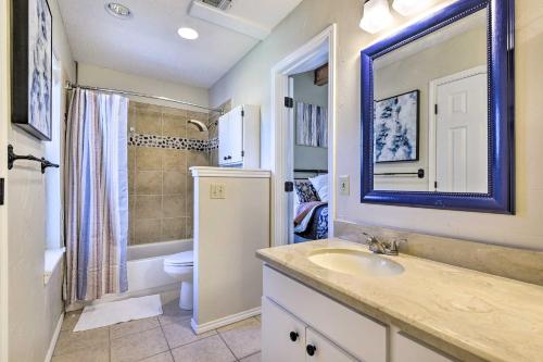a bathroom with a sink and a toilet and a shower at Granbury Home with Lake Granbury Access and Dock! in Granbury