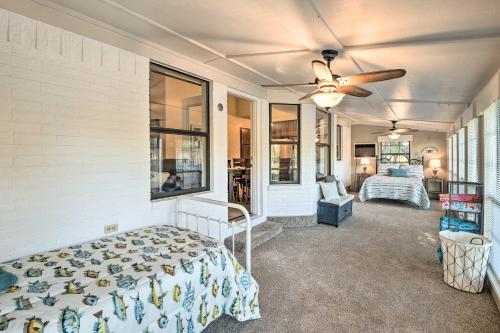 a bedroom with a bed and a ceiling fan at Granbury Home with Lake Granbury Access and Dock! in Granbury