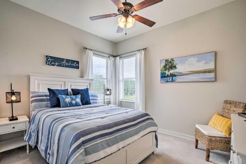 a bedroom with a bed and a ceiling fan at Luxury Naples Home with Private Pool and Hot Tub! in Naples