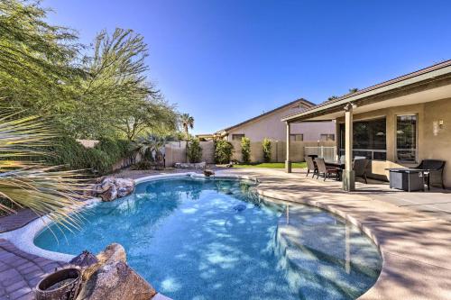 a swimming pool in the backyard of a house at Tee Off, Relax Poolside! Family Home in Scottsdale in Scottsdale