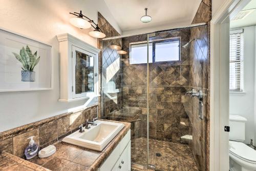 a bathroom with a sink and a shower at Airy Scottsdale Oasis with Pool and Putting Green in Scottsdale
