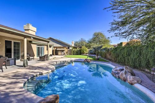 a swimming pool in the backyard of a house at Tee Off, Relax Poolside! Family Home in Scottsdale in Scottsdale