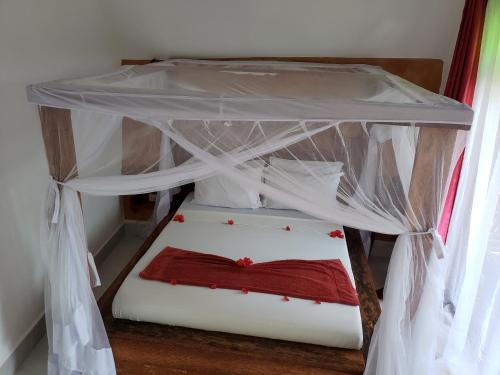 Postel nebo postele na pokoji v ubytování Sagando Bungalows Zanzibar