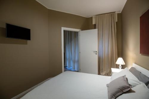Appartamento Kosta tesisinde bir odada yatak veya yataklar