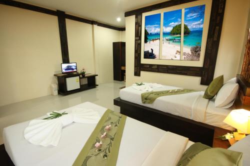 Кровать или кровати в номере Bida Daree Resort