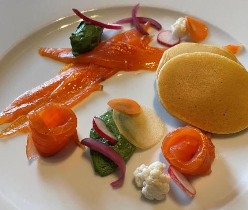 a plate of food with carrots and vegetables on it at LA PLANETTE in Aussonne