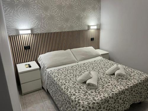 A bed or beds in a room at Les Artes
