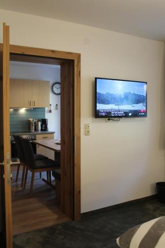 a flat screen tv on the wall of a room at Chasa Patria Apartments in Ischgl