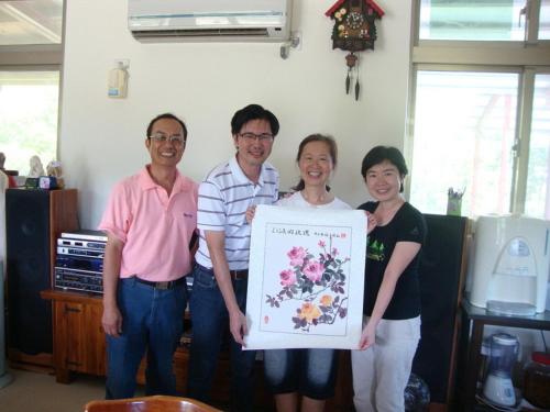 a group of people holding up a sign at Taroko Sialin Coffee Farm Homestay in Xiulin