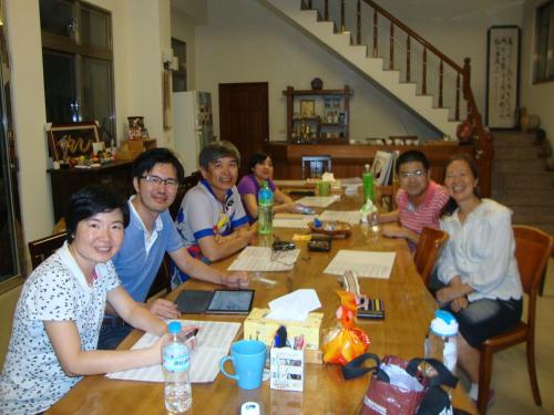 a group of people sitting around a table at Taroko Sialin Coffee Farm Homestay in Xiulin