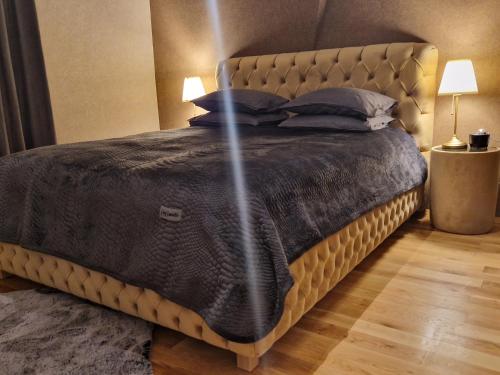 A bed or beds in a room at Апартамент RESORT SENSATION 3