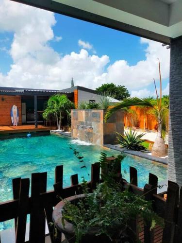 a large swimming pool in front of a building at Villa Lou Santen Guadeloupe in Saint-François