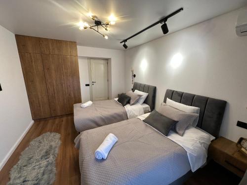 a bedroom with two beds and a unintention at Golden Old Avlabari in Tbilisi City