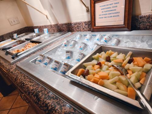 a buffet line with many different types of food at Chase Suite Hotel Newark Fremont in Newark