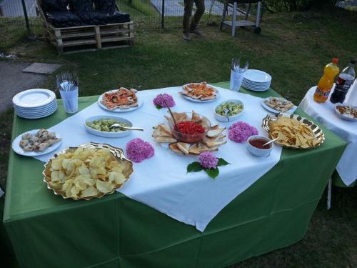 a table with plates of food on it at Hotel Mirabeau in Bellagio