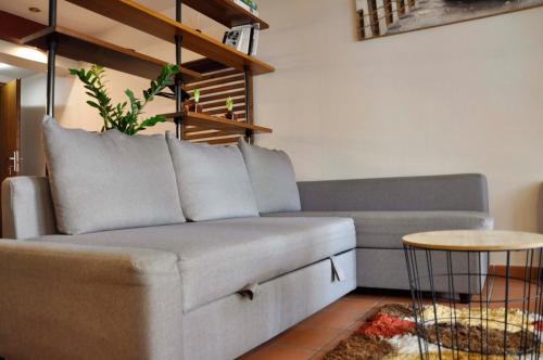 a living room with a couch and a table at Sea La Vie in Volos