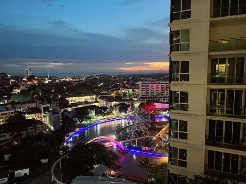 a view of a city at night with a building at The Shore Melaka in Melaka