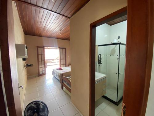 a bathroom with a shower and a sink and a toilet at Pousada do Foguete in Cabo Frio