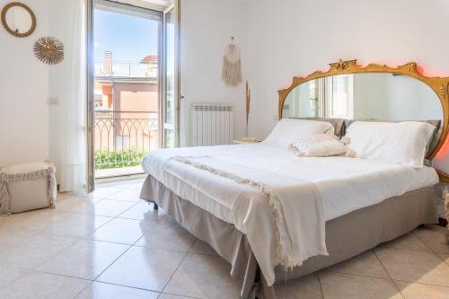 Una cama o camas en una habitación de MARCHE FULL EXPERIENCE-Apartments
