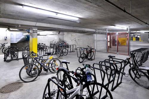 a bunch of bikes parked in a parking garage at Aspens by WB Vacation Rentals in Whistler