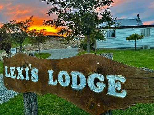 a wooden sign with the words jesus lodge at Lexi's Lodge in Lake Tekapo