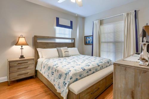 a bedroom with a bed and a dresser and a window at 204 Bay Harbor in Clearwater Beach
