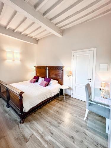 Ένα ή περισσότερα κρεβάτια σε δωμάτιο στο B&B Palazzo Bruchi
