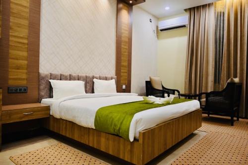 En eller flere senge i et værelse på BUDDHA HERITAGE RESORT