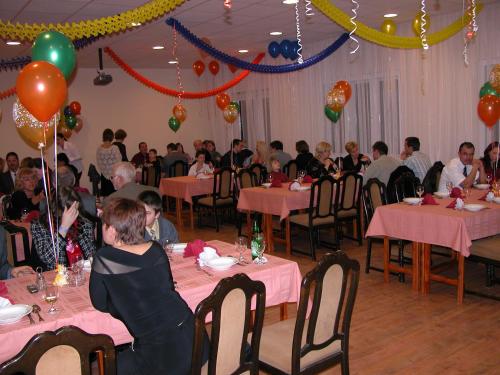 a group of people sitting at tables in a room at Hárs Thermál Hotel in Gyomaendrőd