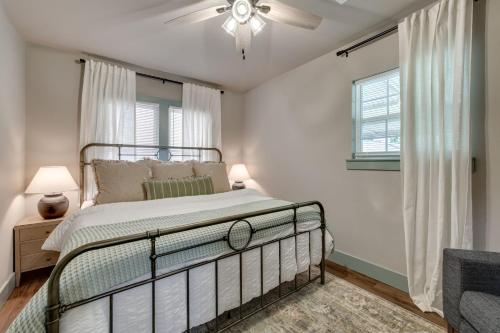 a bedroom with a bed and a ceiling fan at Charming 2 bed 1 bath Tudor - Near Plaza & Midtown in Oklahoma City
