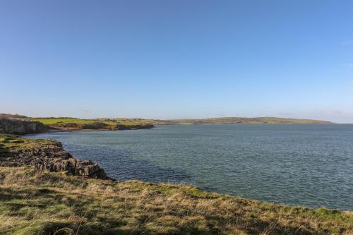 a view of a large body of water at Haulfryn in Moelfre