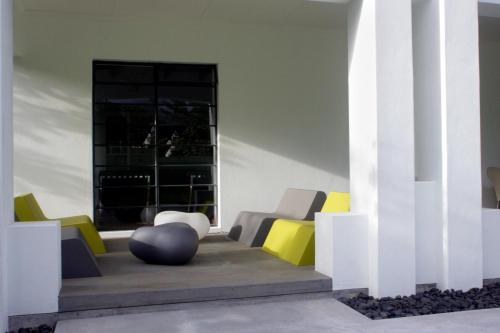 a lobby with colorful chairs and a large ball at Bloomestate Swellendam in Swellendam