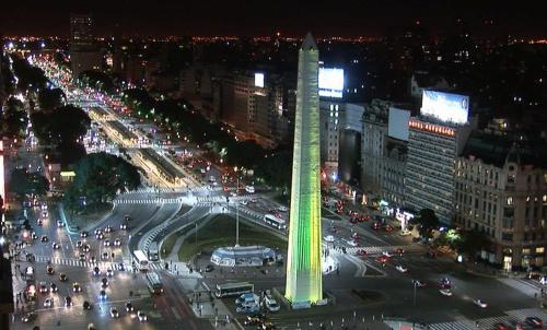 a view of a city at night with a tall tower at Esmeralda Apartment in Buenos Aires