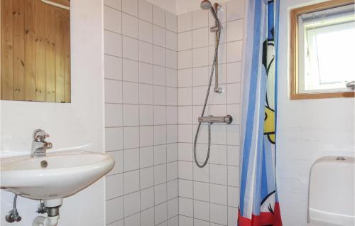 a bathroom with a sink and a shower at Stunning Home In Aakirkeby With Kitchen in Vester Sømarken