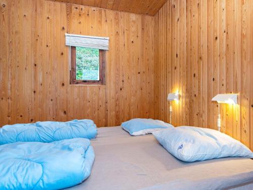 a bedroom with two large pillows on a bed at 4 person holiday home in Aabenraa-By Traum in Aabenraa