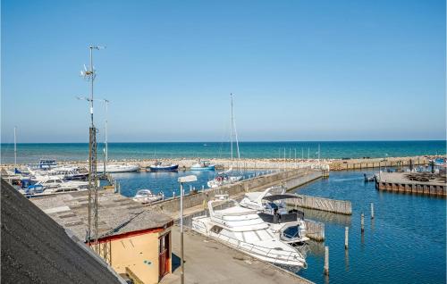 a group of boats docked at a marina at 2 Bedroom Awesome Home In Glesborg in Glesborg