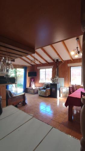 a large living room with a couch and a table at Ruka Experience in Pucón