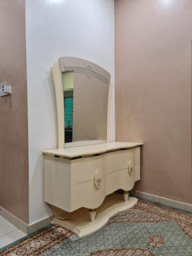 a dressing table with a mirror on top of it at HOMESTAY EPOH MANJOI WITH PRIVATE POOL AND JACUZZI in Ipoh