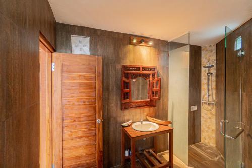 a bathroom with a sink and a shower at Villa Kanha by Bukit Vista in Jimbaran
