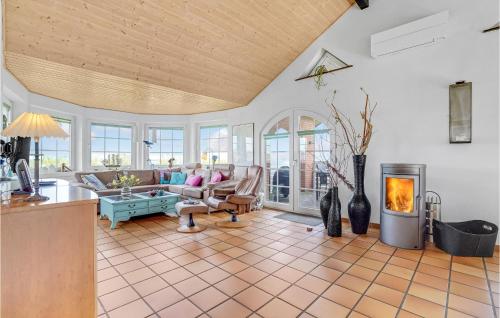 a kitchen and living room with a fireplace at Awesome Home In Lemvig With Kitchen in Lemvig