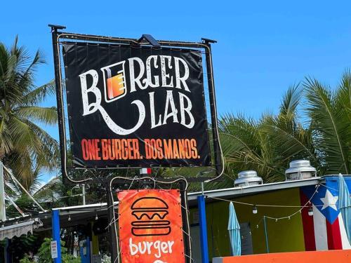 a sign for a barber lab in front of a building at Casa Rosado Villa Marina Fajardo Yunque Seven Seas in Fajardo