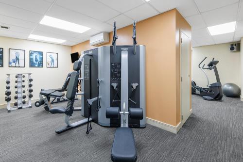 a gym with treadmills and elliptical machines at Adina Citylife Wellington in Wellington