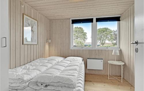 a large bed in a room with a window at Amazing Home In Malling With Kitchen in Malling