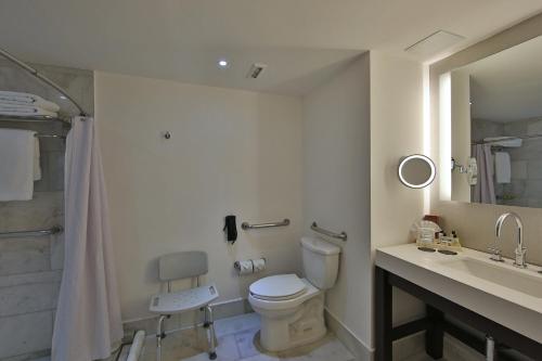 a bathroom with a toilet and a sink and a shower at Intercontinental Real Guatemala by IHG in Guatemala
