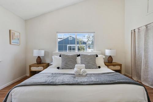 a bedroom with a large bed and a window at @ Marbella Lane – Home with Majestic Ocean Views in Pacifica