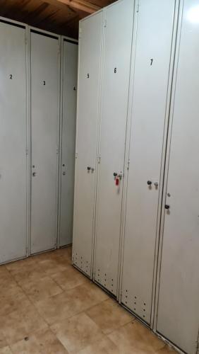 a row of white lockers in a room at Tuhogarencerler parking y taquilla en pistas in Cerler