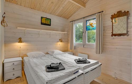 a bedroom with two beds and a window at Cozy Home In Kalundborg With Kitchen in Kalundborg
